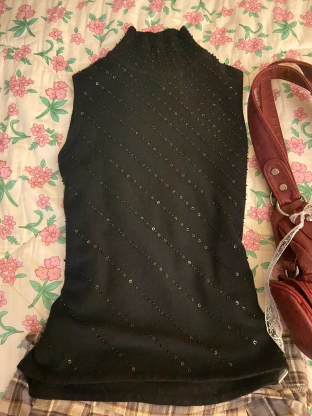 Black sleeveless turtleneck